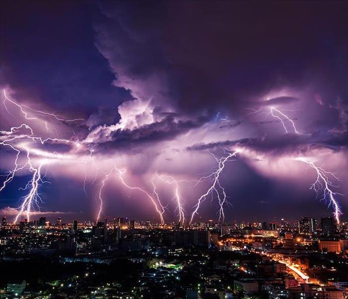 multiple lightning strikes across a city