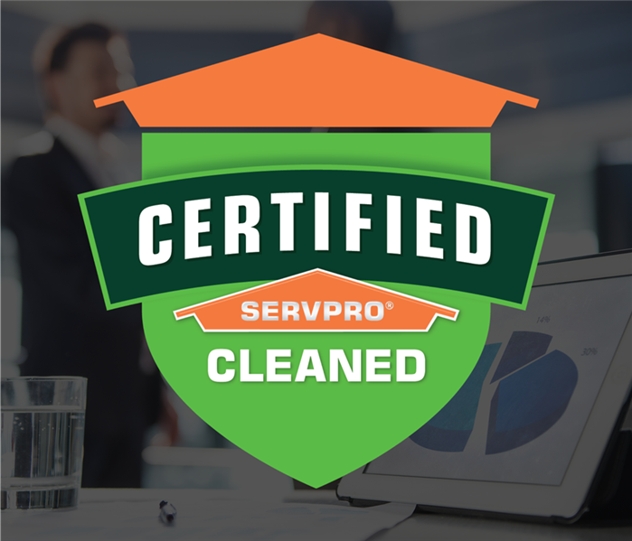 two people shaking hands with an Certified: SERVPRO Cleaned sticker over the photo